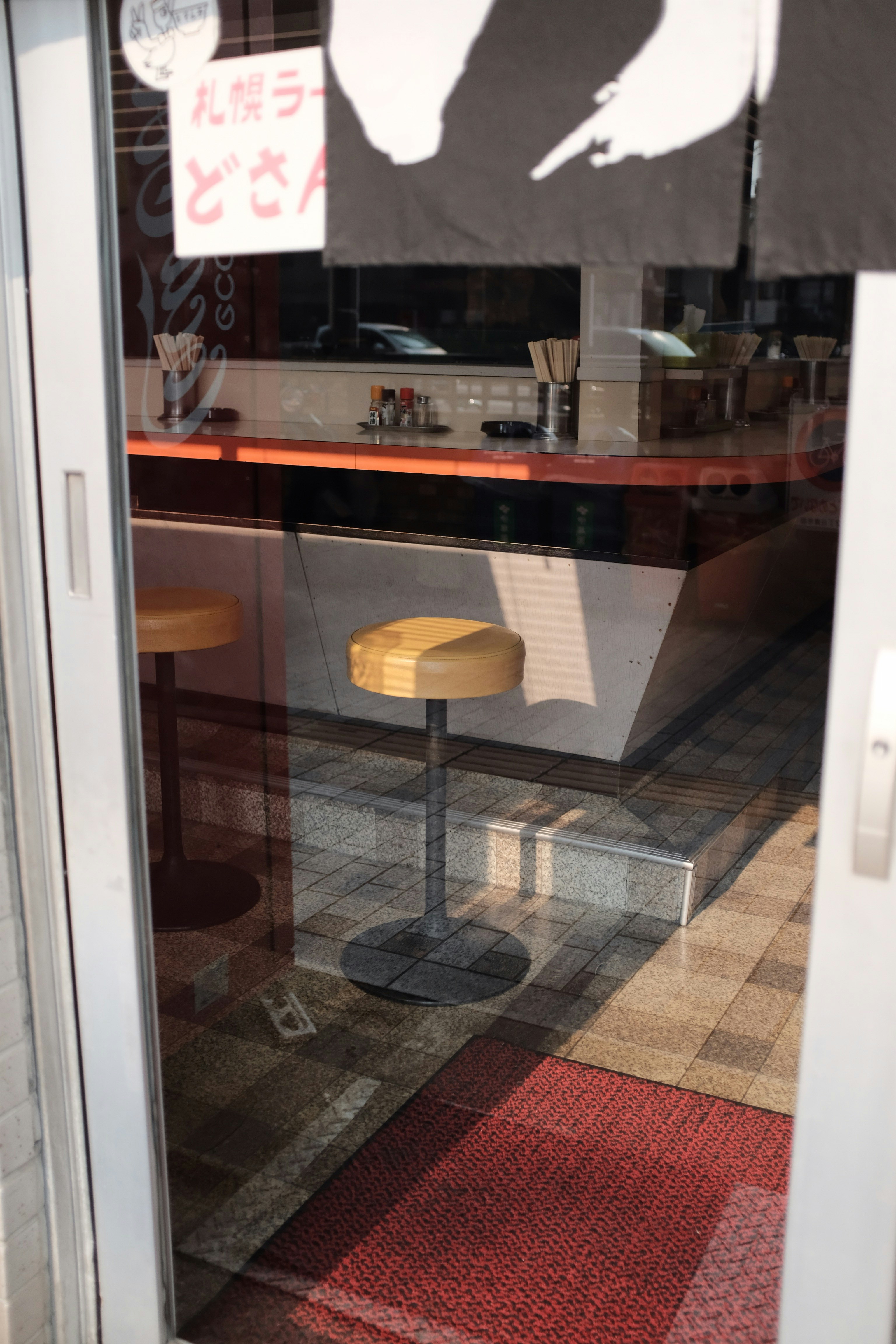 round brown and black stool